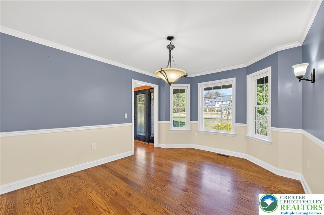 202 Cherry Court Nazareth, PA 18064 - Photo 19 of 43 a view of an empty room with a window and wooden floor