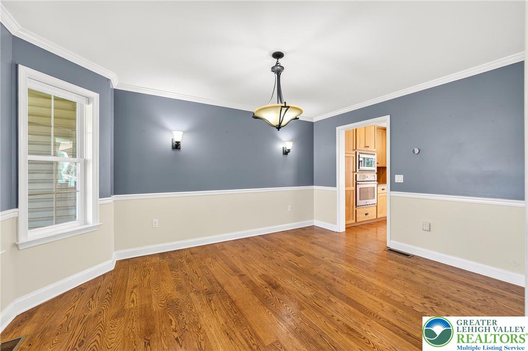 202 Cherry Court Nazareth, PA 18064 - Photo 20 of 43 a view of an empty room with window and wooden floor