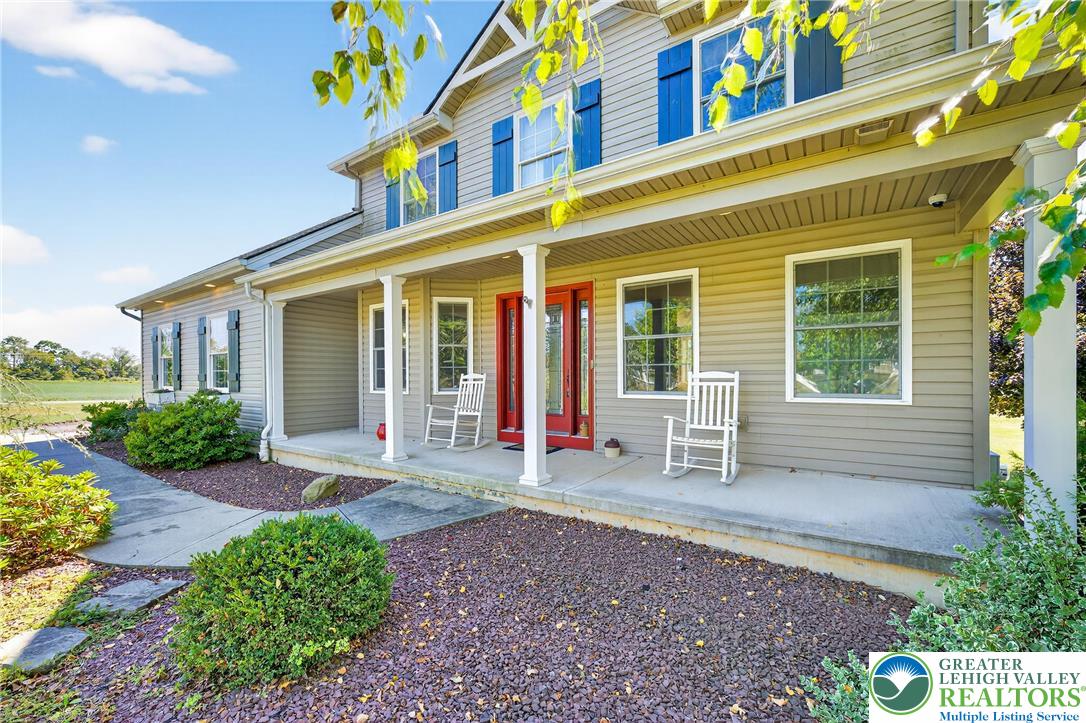 202 Cherry Court Nazareth, PA 18064 - Photo 2 of 43 a view of brick building with large windows and potted plants