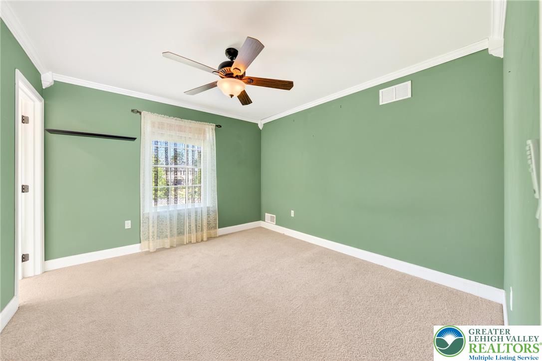 202 Cherry Court Nazareth, PA 18064 - Photo 23 of 43 a view of a big room with windows and ceiling fan
