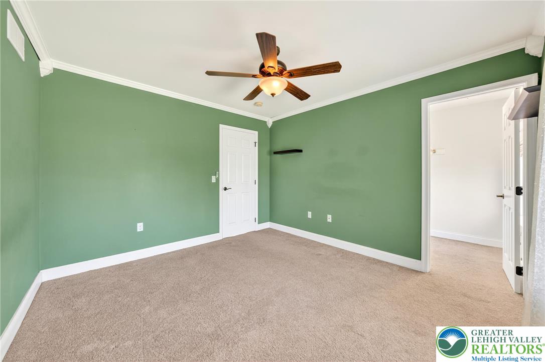 202 Cherry Court Nazareth, PA 18064 - Photo 24 of 43 a view of a room with a ceiling fan and carpet