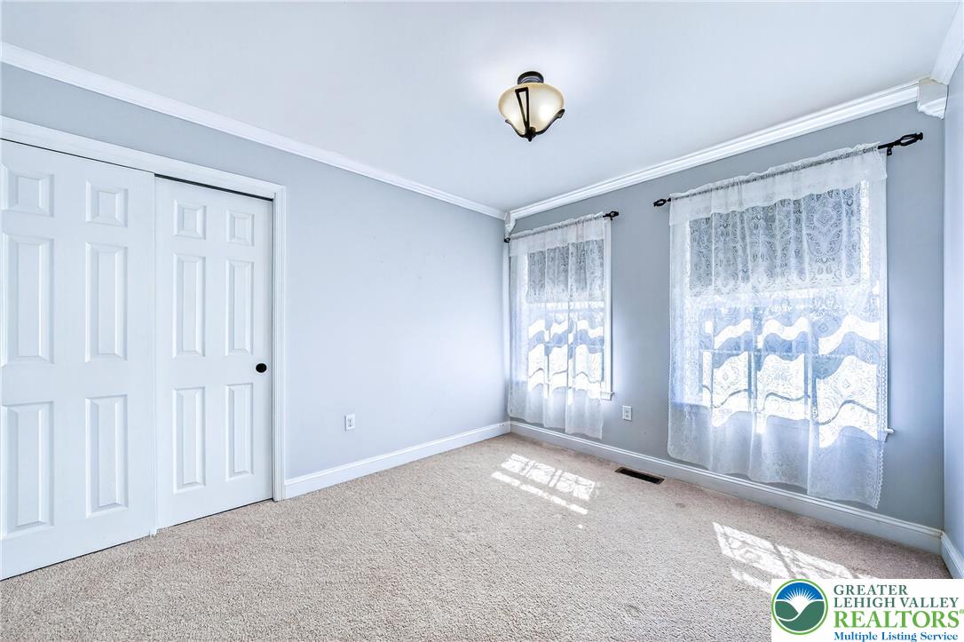202 Cherry Court Nazareth, PA 18064 - Photo 25 of 43 an empty room with windows and closet