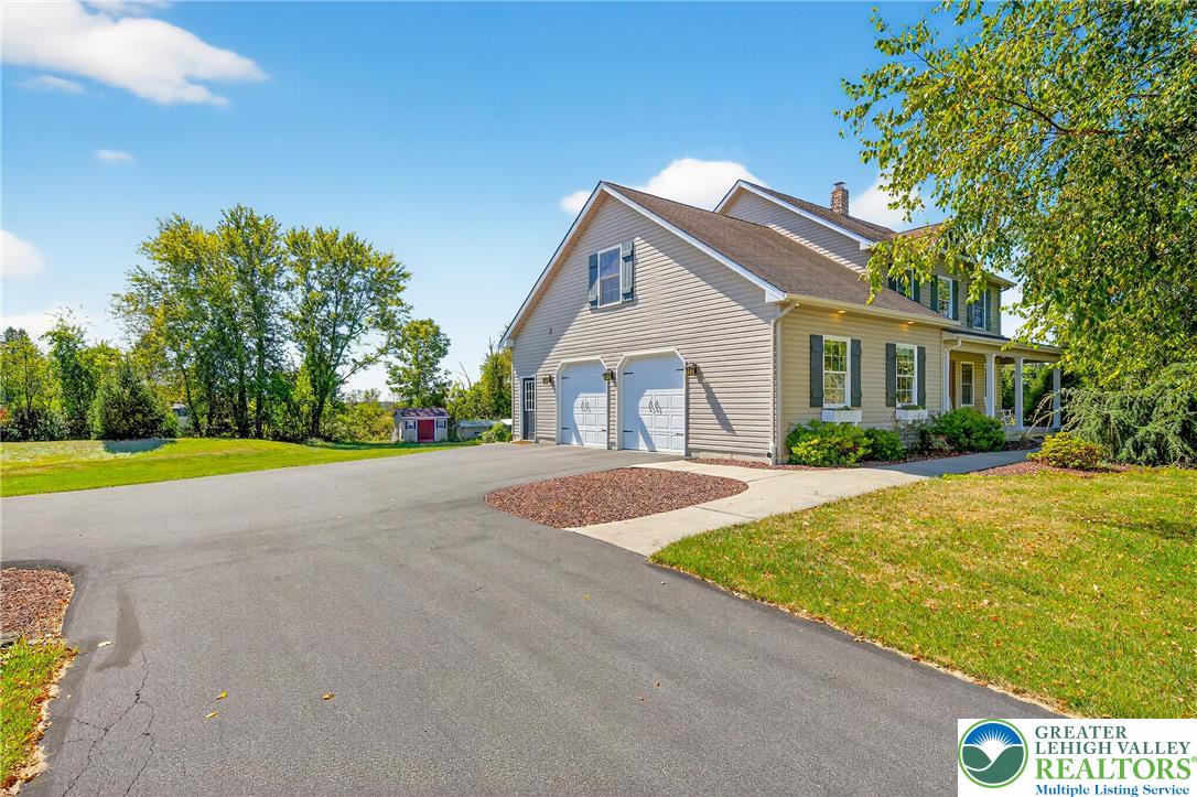 202 Cherry Court Nazareth, PA 18064 - Photo 3 of 43 a front view of house with yard and green space
