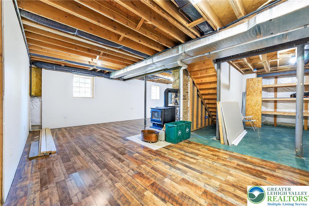 202 Cherry Court Nazareth, PA 18064 - Photo 39 of 43 a bedroom with a bed and wooden floor