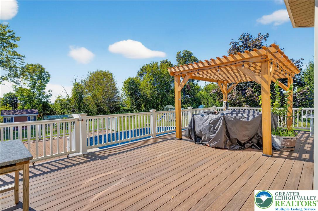 202 Cherry Court Nazareth, PA 18064 - Photo 40 of 43 a view of a roof deck with wooden floor and fence