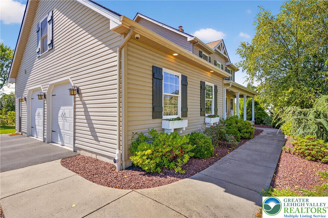 202 Cherry Court Nazareth, PA 18064 - Photo 4 of 43 a view of a house with potted plants