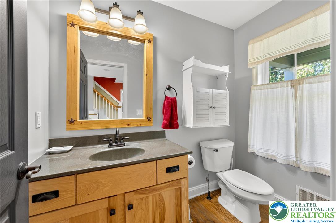 202 Cherry Court Nazareth, PA 18064 - Photo 8 of 43 a bathroom with a toilet a sink and a mirror