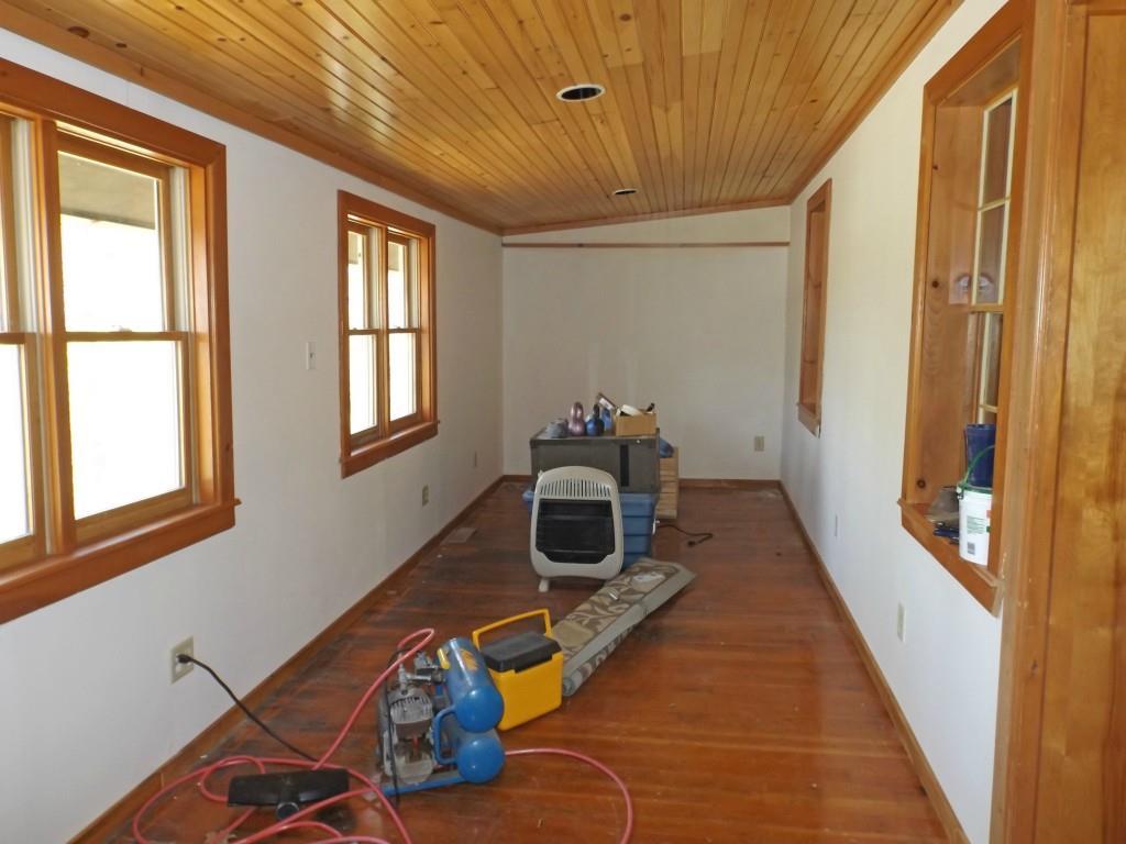 13 Norwood Road Dedham, ME 04429 - Photo 5 of 21 Four-season sunporch is 25' long.