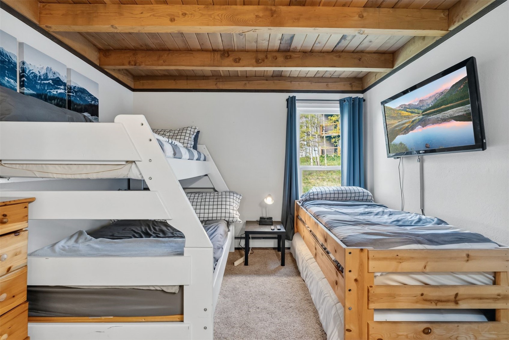 8100 Ryan Gulch Road, Unit 106 Wildernest, CO 80498 - Photo 18 of 43 a spacious bedroom with a bed and a walk in closet