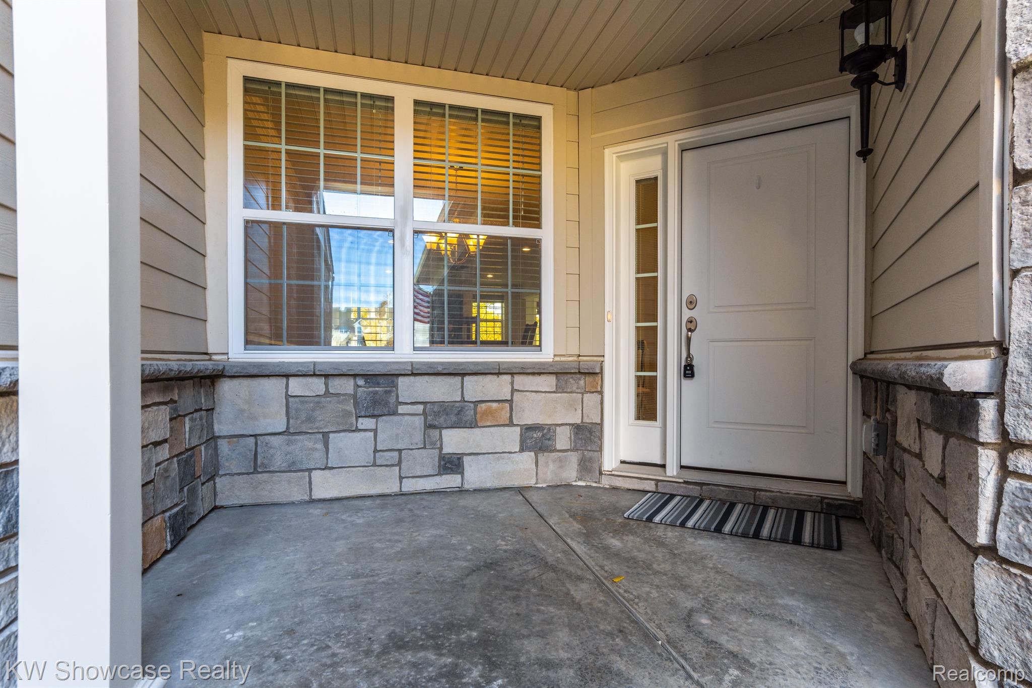 42768 Cardinal Way Novi, MI 48375 - Photo 4 of 42 The front door is a sharp covered area.