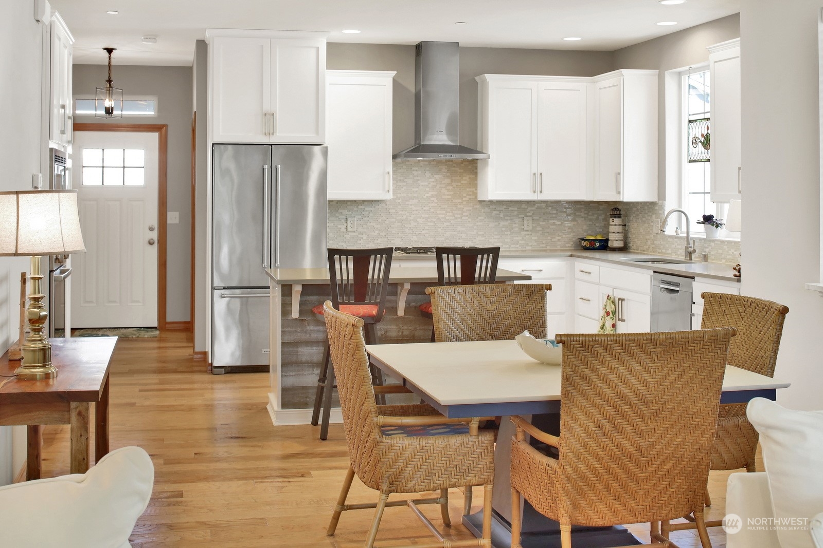 734 Fuchsia Loop Bellingham, WA 98226 - Photo 11 of 27 a living room with stainless steel appliances kitchen island granite countertop furniture and a wooden floor