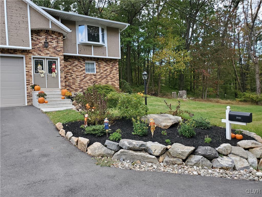 2121 Mountain Road Slatington, PA 18080 - Photo 3 of 45 a backyard of a house with lots of green space and fountain