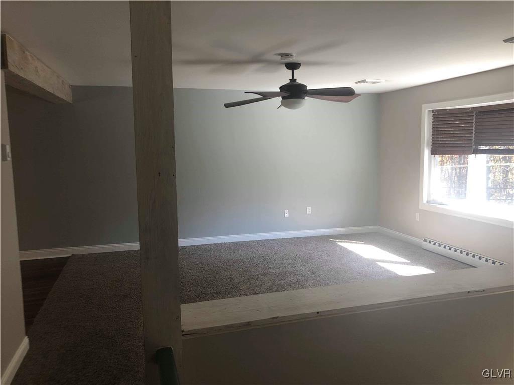 2121 Mountain Road Slatington, PA 18080 - Photo 38 of 45 en empty room with windows and fan