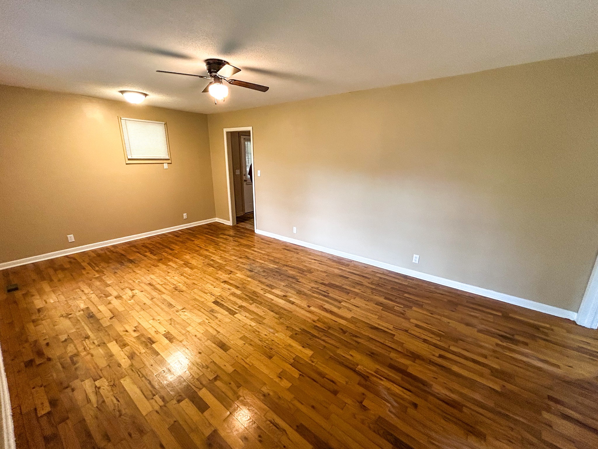 181 Jones Street Huntingdon, TN 38344 - Photo 10 of 21 a view of an empty room with wooden floor