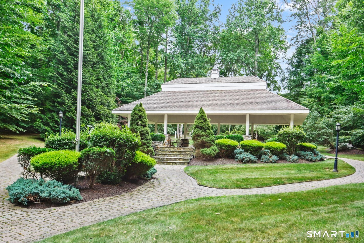 223 Meadow Brook Road, Unit 223 Oxford, CT 06478 - Photo 27 of 34 a front view of a house with a yard