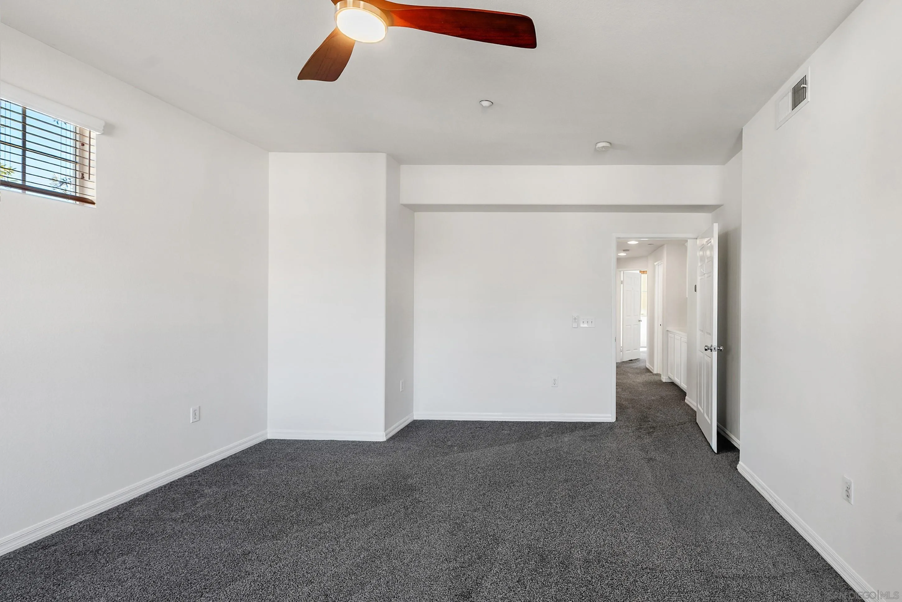 2185 Caminito Rinaldo, Unit 118 Chula Vista, CA 91915 - Photo 12 of 38 an empty room with windows