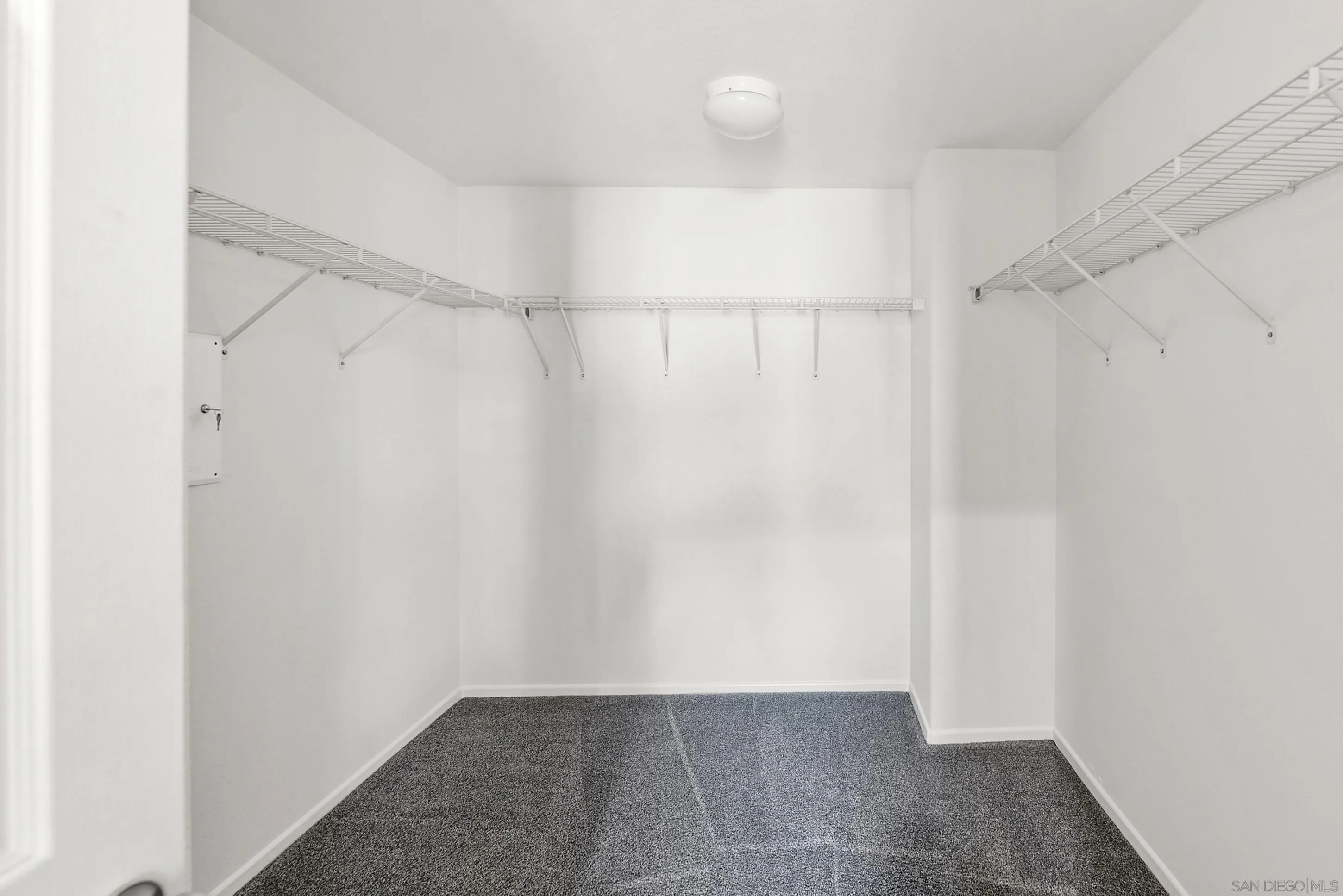 2185 Caminito Rinaldo, Unit 118 Chula Vista, CA 91915 - Photo 17 of 38 a view of an empty walk in closet