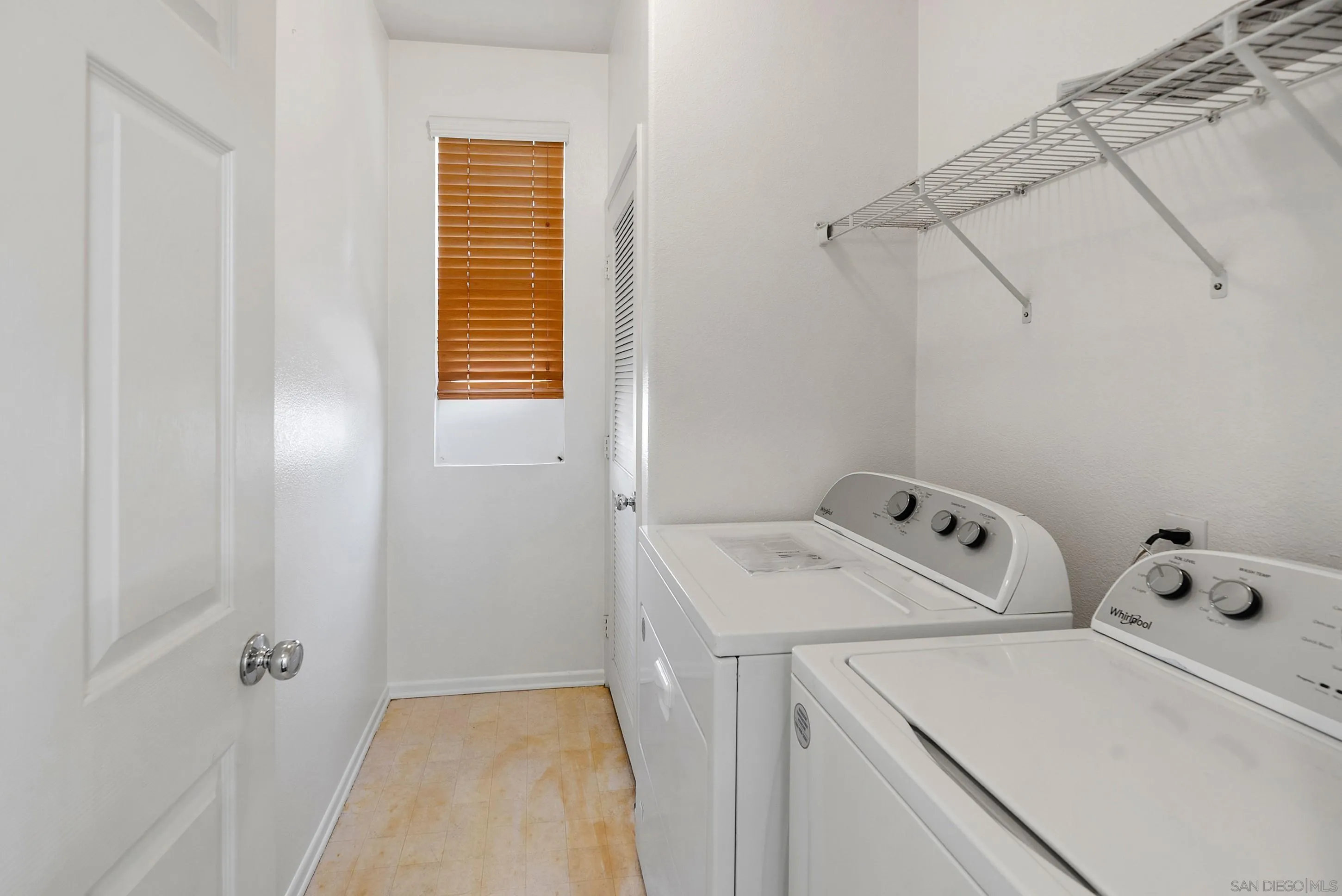 2185 Caminito Rinaldo, Unit 118 Chula Vista, CA 91915 - Photo 19 of 38 a utility room with dryer and washer