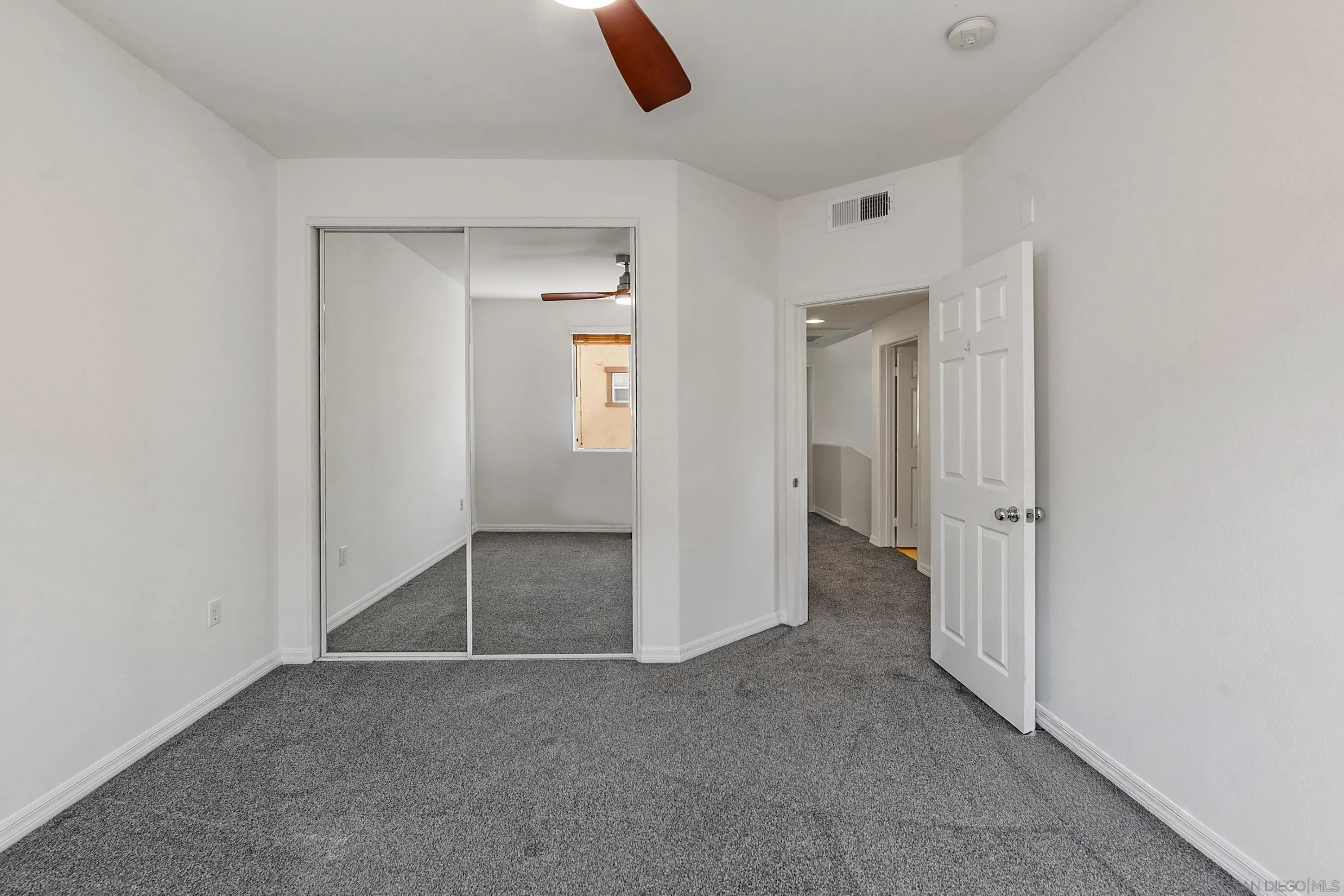 2185 Caminito Rinaldo, Unit 118 Chula Vista, CA 91915 - Photo 22 of 38 an empty room with windows and closet