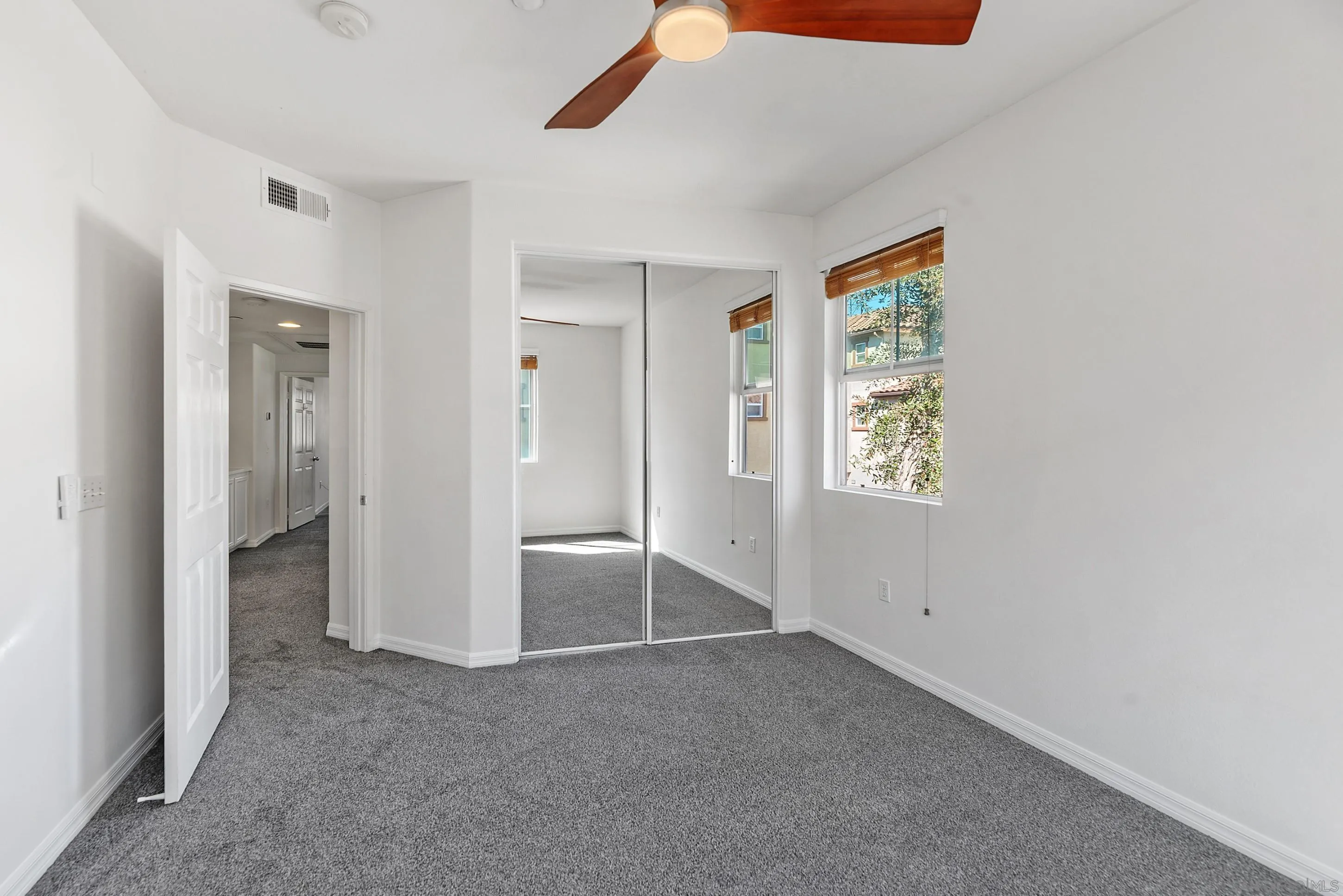 2185 Caminito Rinaldo, Unit 118 Chula Vista, CA 91915 - Photo 24 of 38 an empty room with windows and closet
