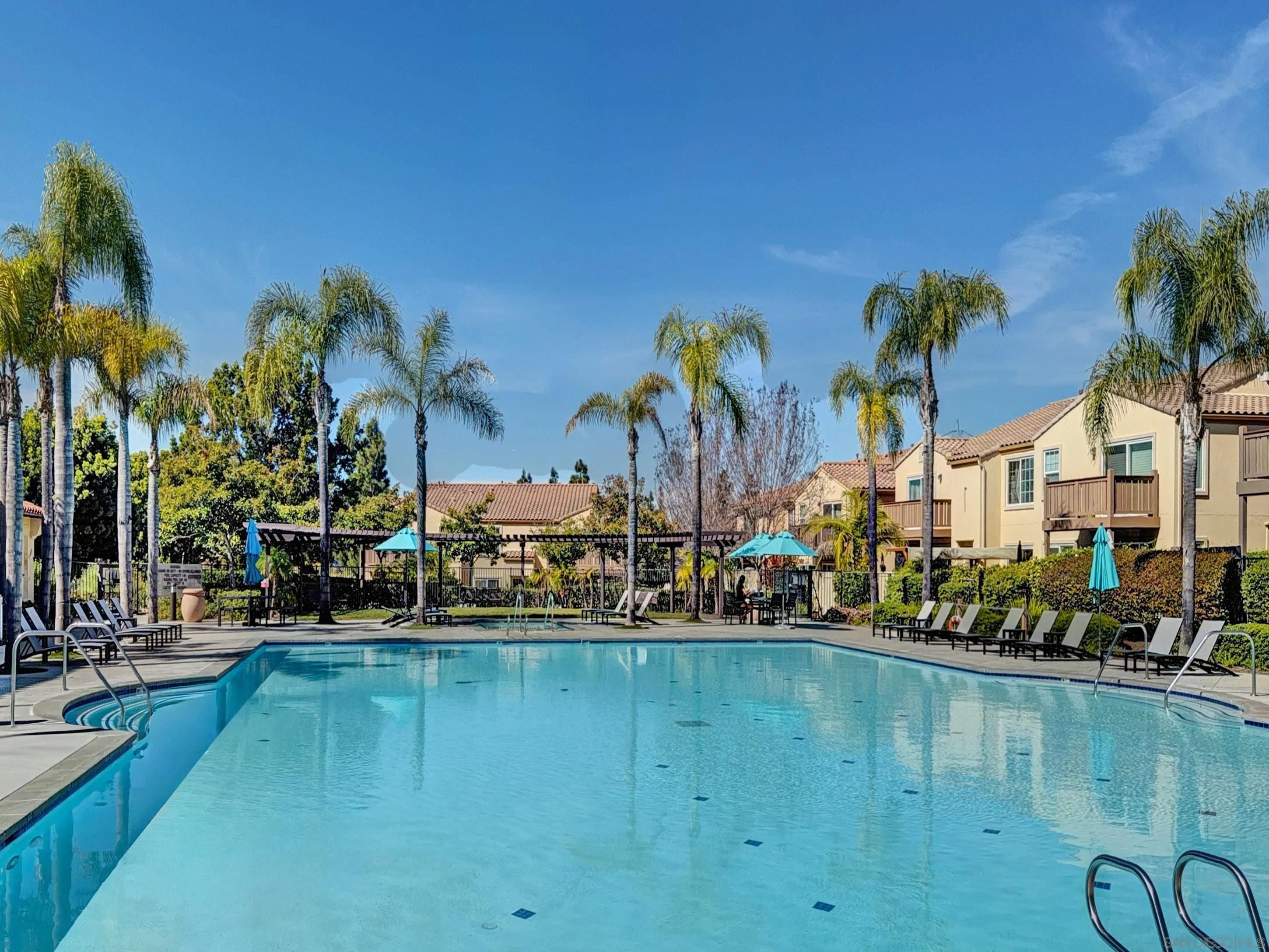 2185 Caminito Rinaldo, Unit 118 Chula Vista, CA 91915 - Photo 32 of 38 a view of swimming pool with outdoor seating