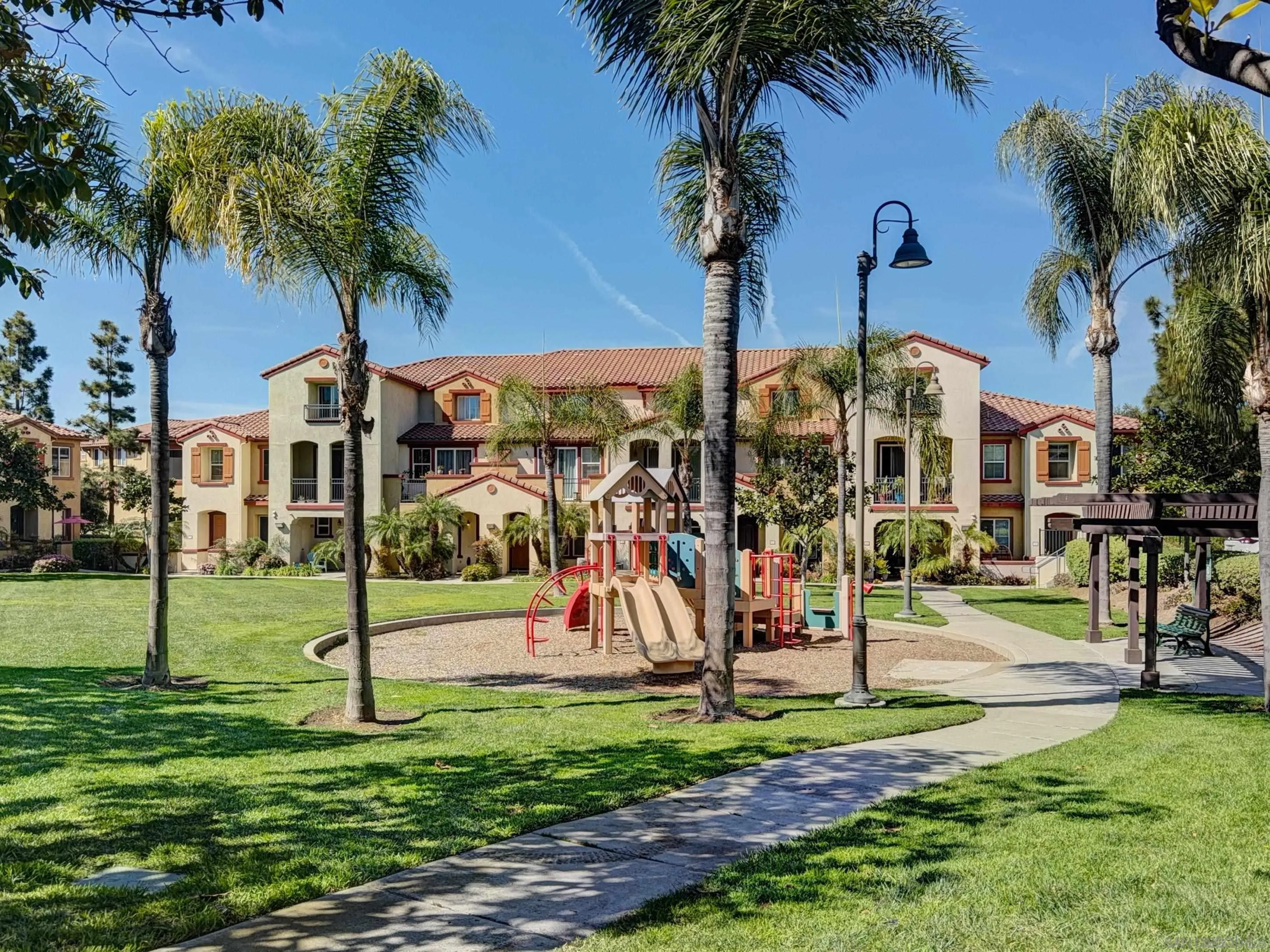 2185 Caminito Rinaldo, Unit 118 Chula Vista, CA 91915 - Photo 33 of 38 a view of a park with palm trees