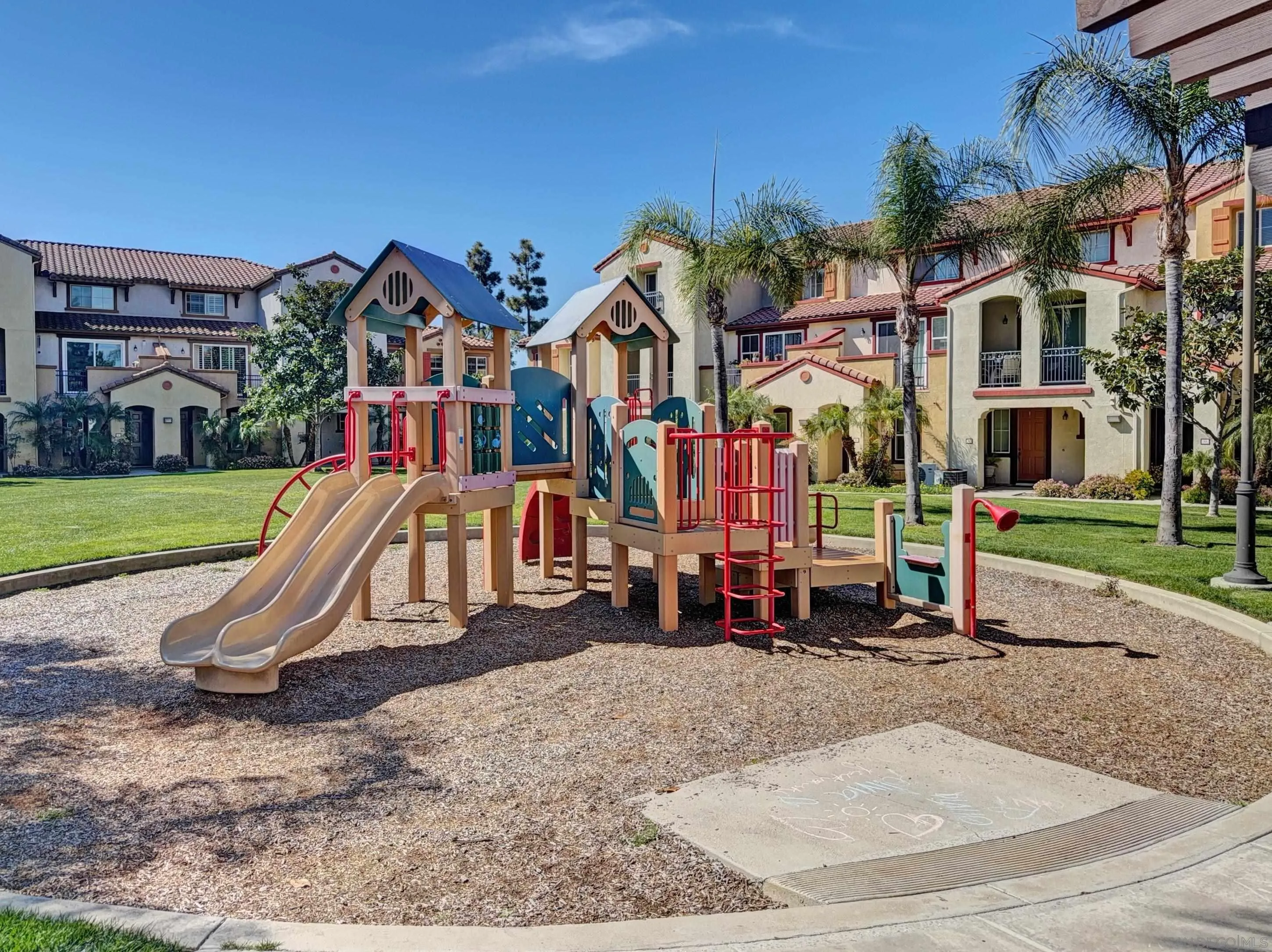 2185 Caminito Rinaldo, Unit 118 Chula Vista, CA 91915 - Photo 34 of 38 a view of a park with swings and slides
