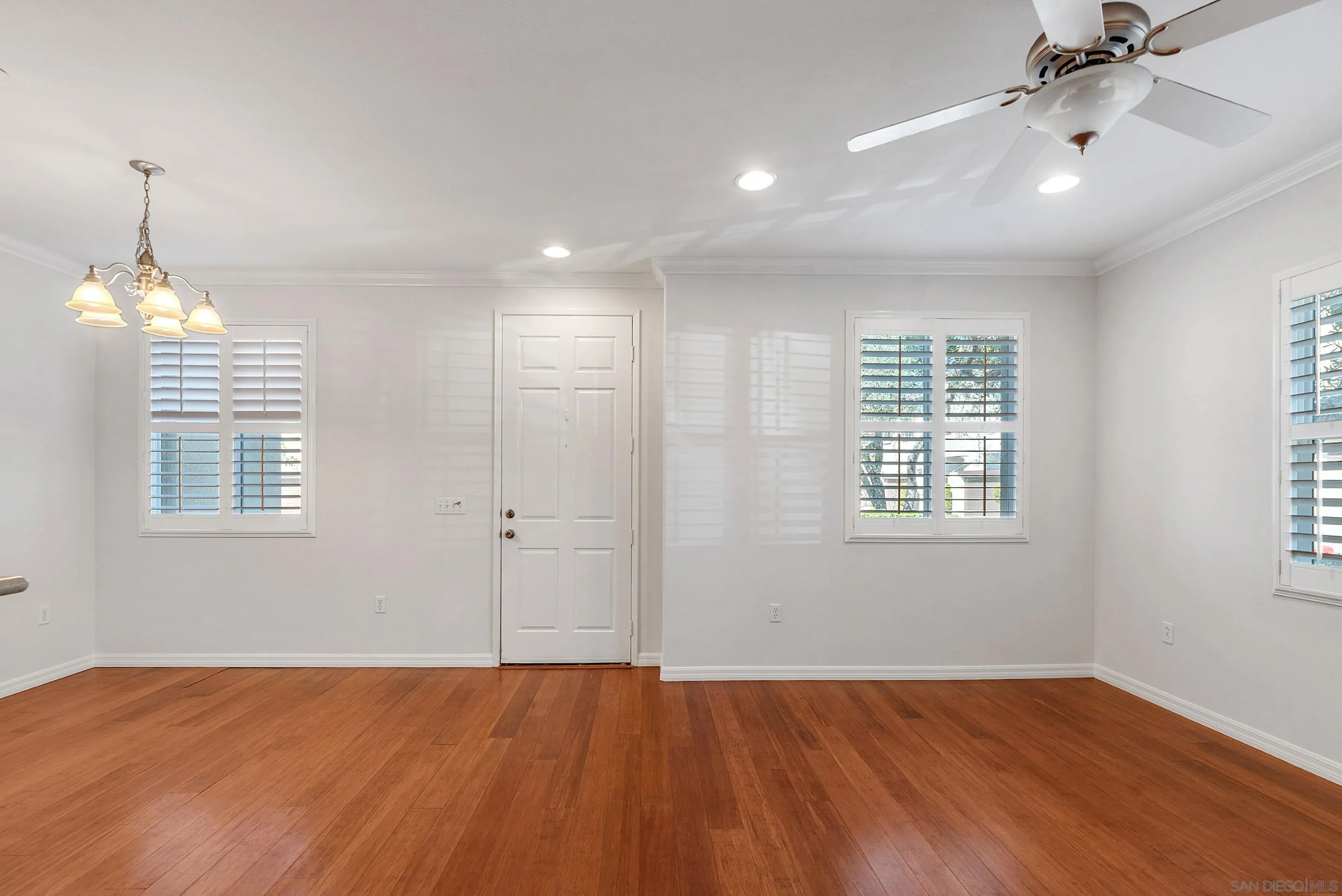2185 Caminito Rinaldo, Unit 118 Chula Vista, CA 91915 - Photo 4 of 38 wooden floor in an empty room with a window
