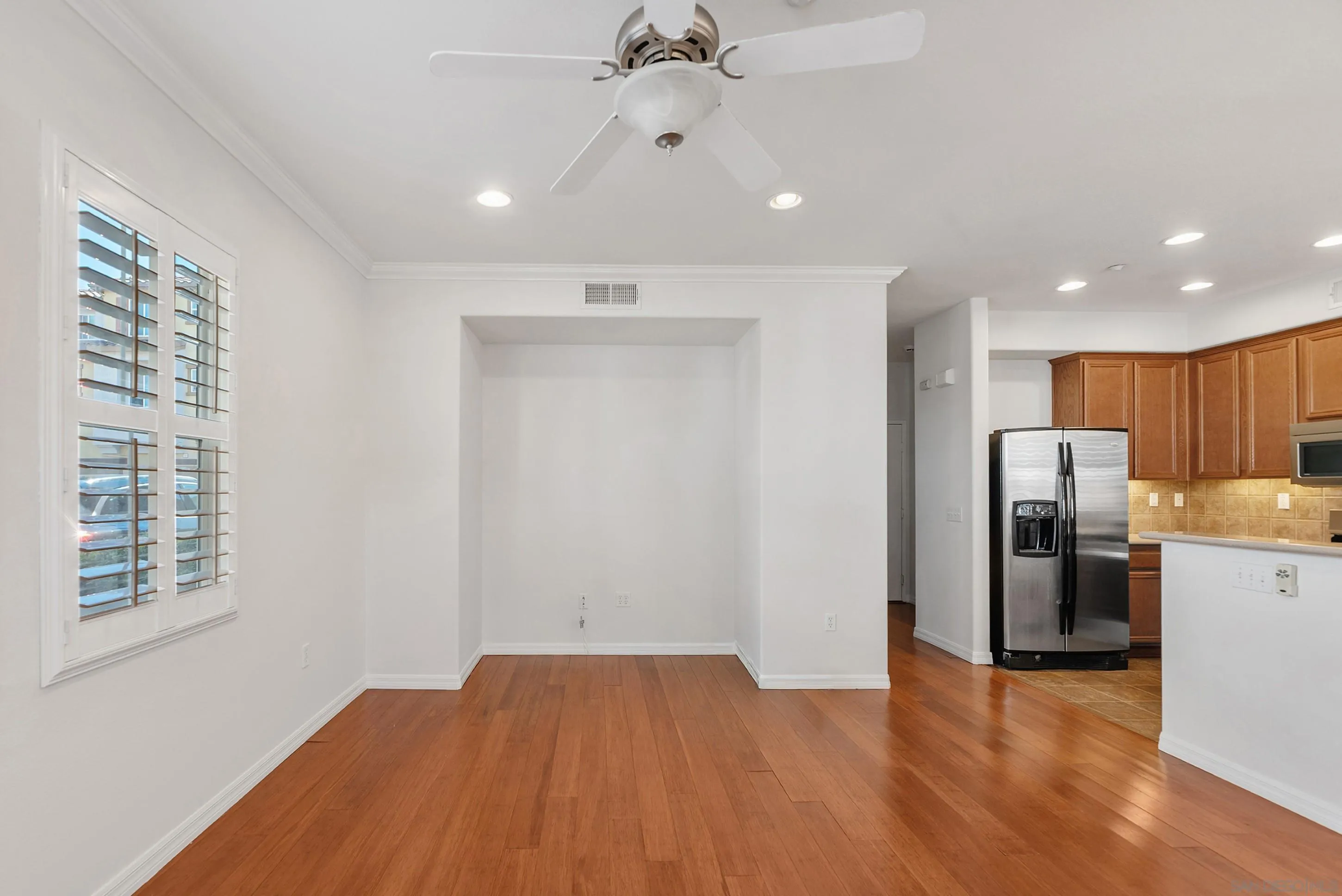 2185 Caminito Rinaldo, Unit 118 Chula Vista, CA 91915 - Photo 5 of 38 a view of a kitchen with a sink a refrigerator and a window