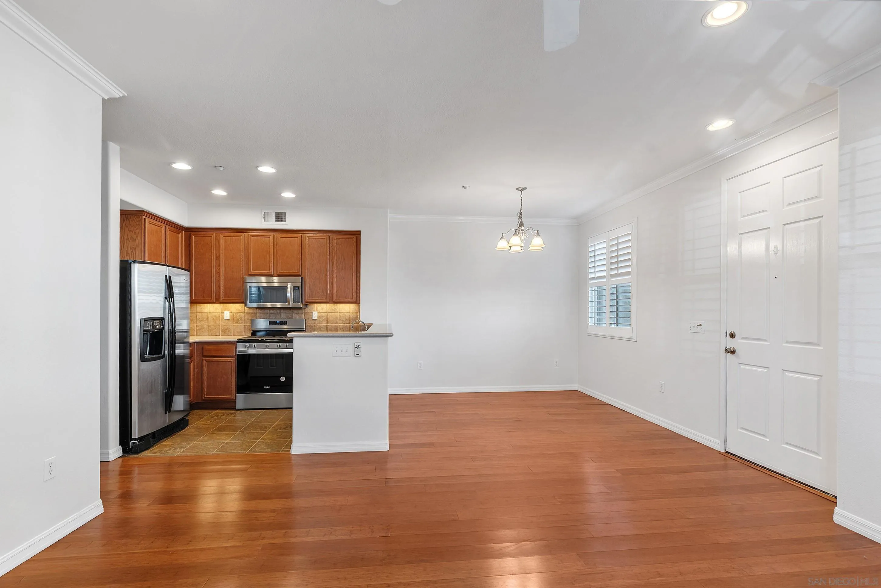 2185 Caminito Rinaldo, Unit 118 Chula Vista, CA 91915 - Photo 7 of 38 a view of a kitchen with a sink and a stove top oven