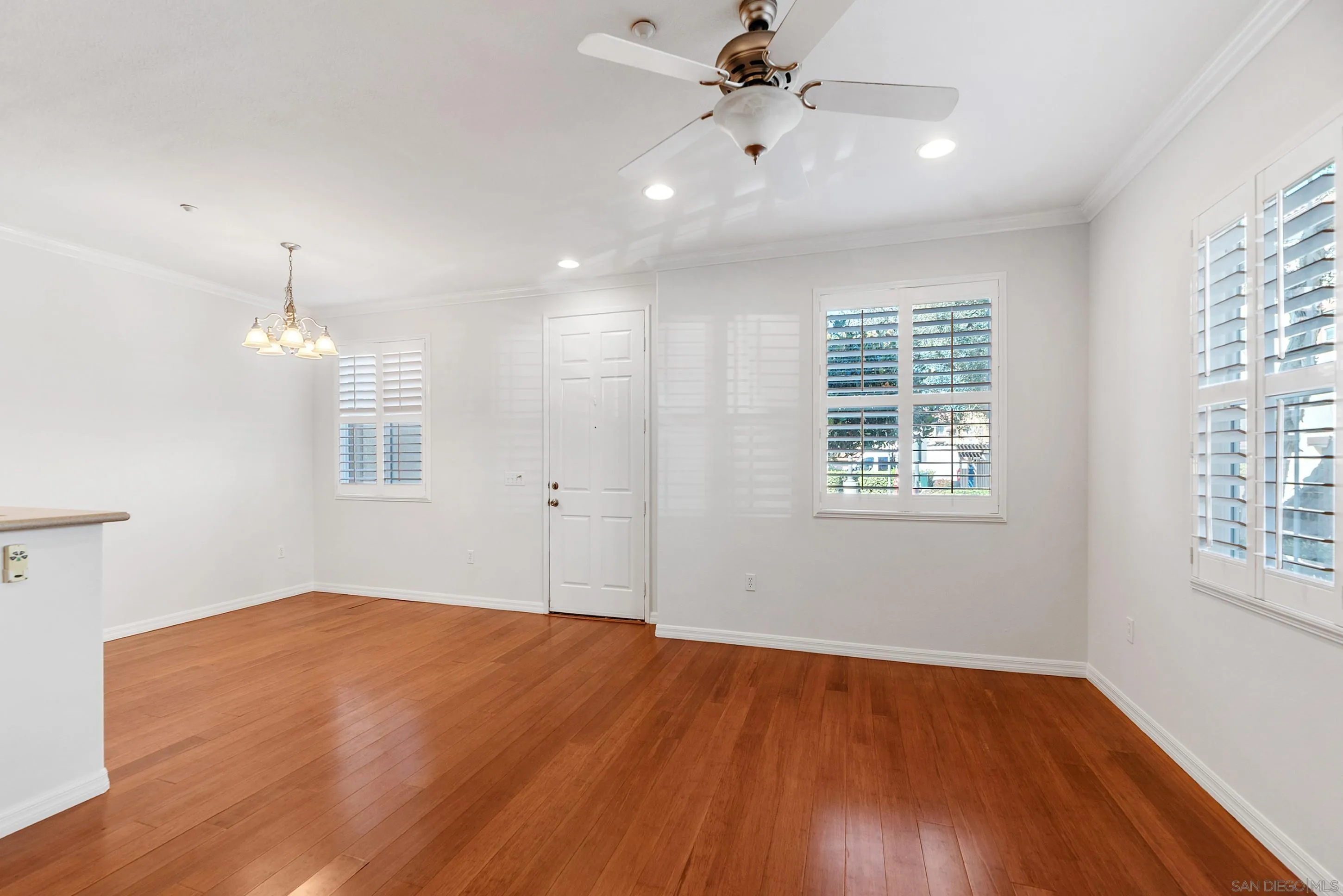 2185 Caminito Rinaldo, Unit 118 Chula Vista, CA 91915 - Photo 8 of 38 a view of an empty room with a window and wooden floor