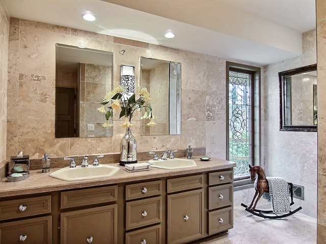 6232 Cunningham Road Rockford, IL 61102 - Photo 23 of 25 a bathroom with a double vanity sink and a mirror