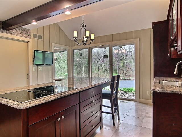 6232 Cunningham Road Rockford, IL 61102 - Photo 9 of 25 a kitchen with granite countertop a sink appliances and a counter top space