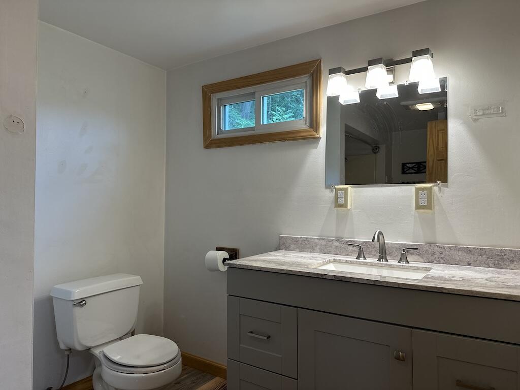 2638 Castleton Road Max Meadows, VA 24360 - Photo 14 of 46 a bathroom with a toilet sink and mirror