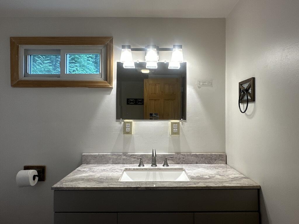 2638 Castleton Road Max Meadows, VA 24360 - Photo 15 of 46 a bathroom with a sink and a mirror