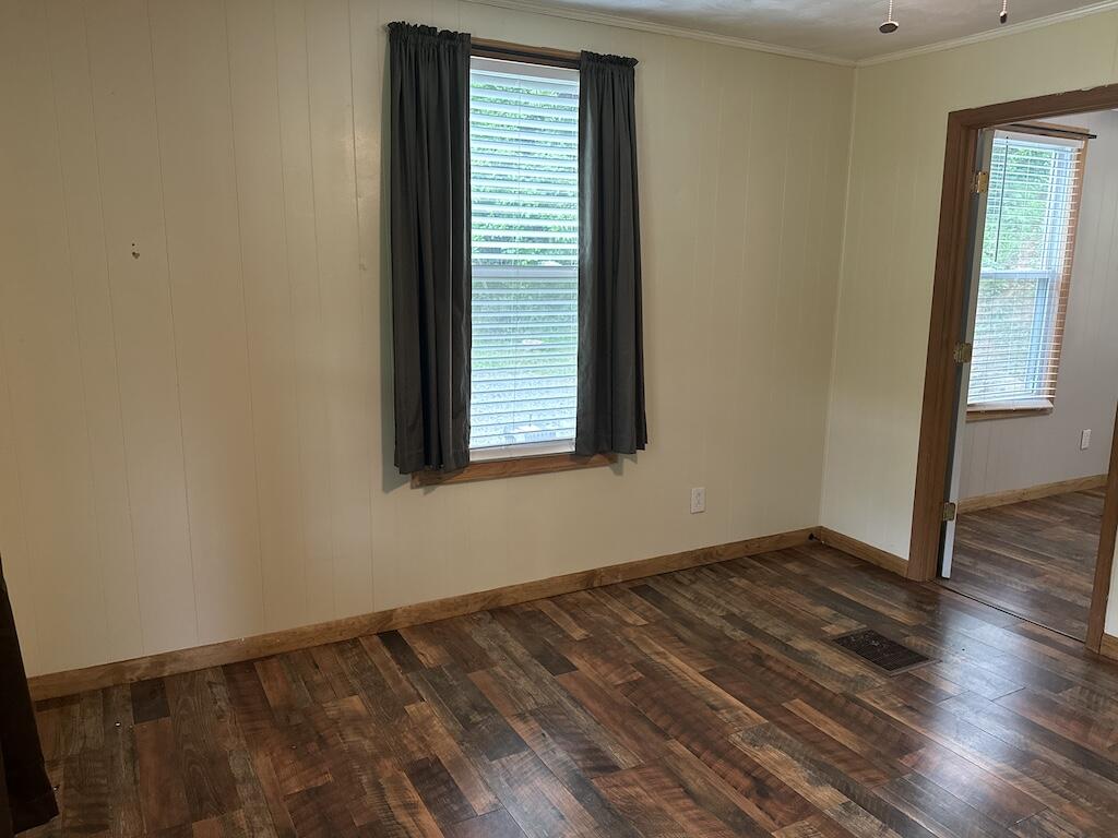 2638 Castleton Road Max Meadows, VA 24360 - Photo 17 of 46 an empty room with wooden floor and windows