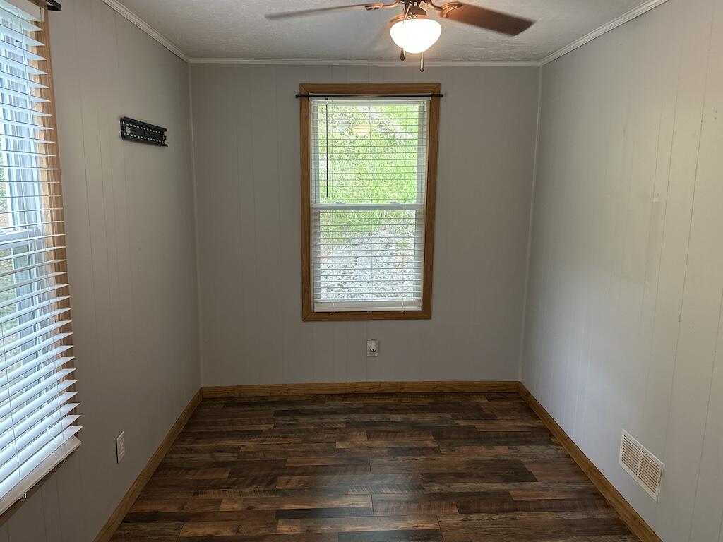 2638 Castleton Road Max Meadows, VA 24360 - Photo 20 of 46 a view of an empty room with wooden floor and a window