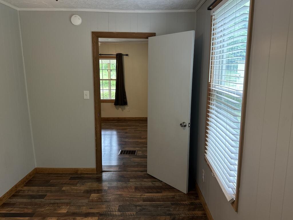 2638 Castleton Road Max Meadows, VA 24360 - Photo 21 of 46 a view of empty room with wooden floor and fan