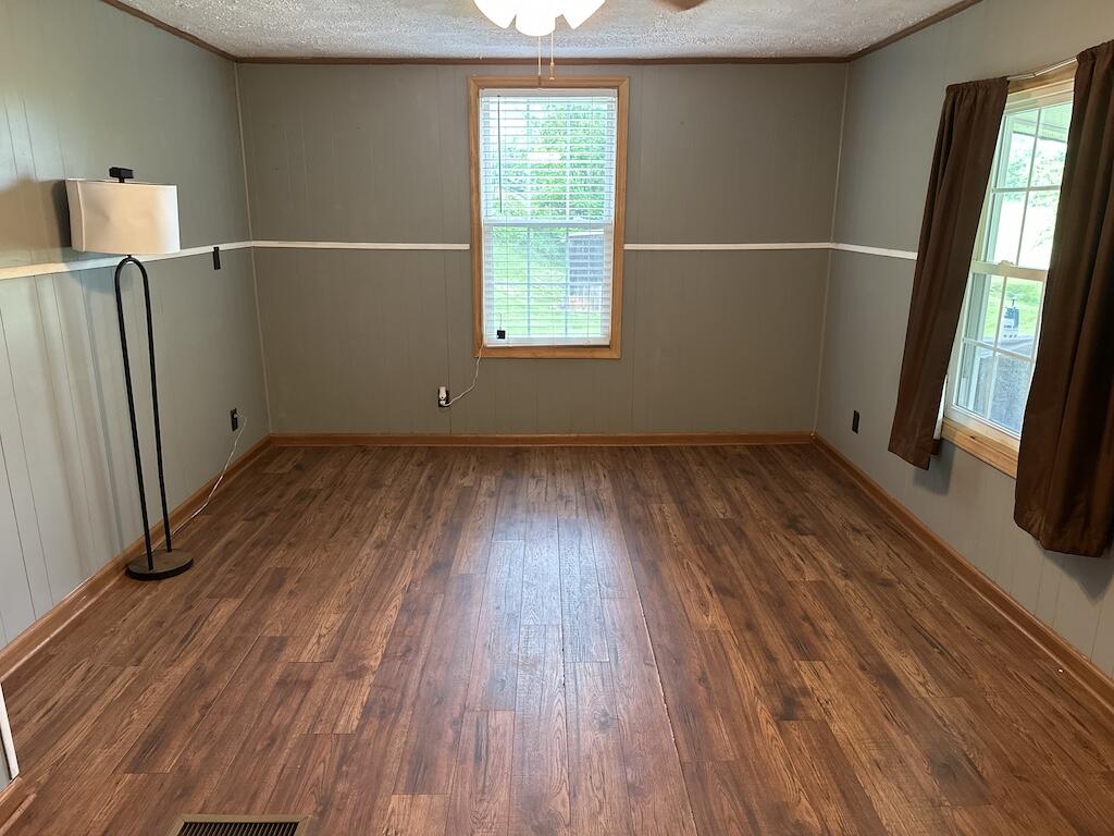 2638 Castleton Road Max Meadows, VA 24360 - Photo 5 of 46 an empty room with wooden floor and windows