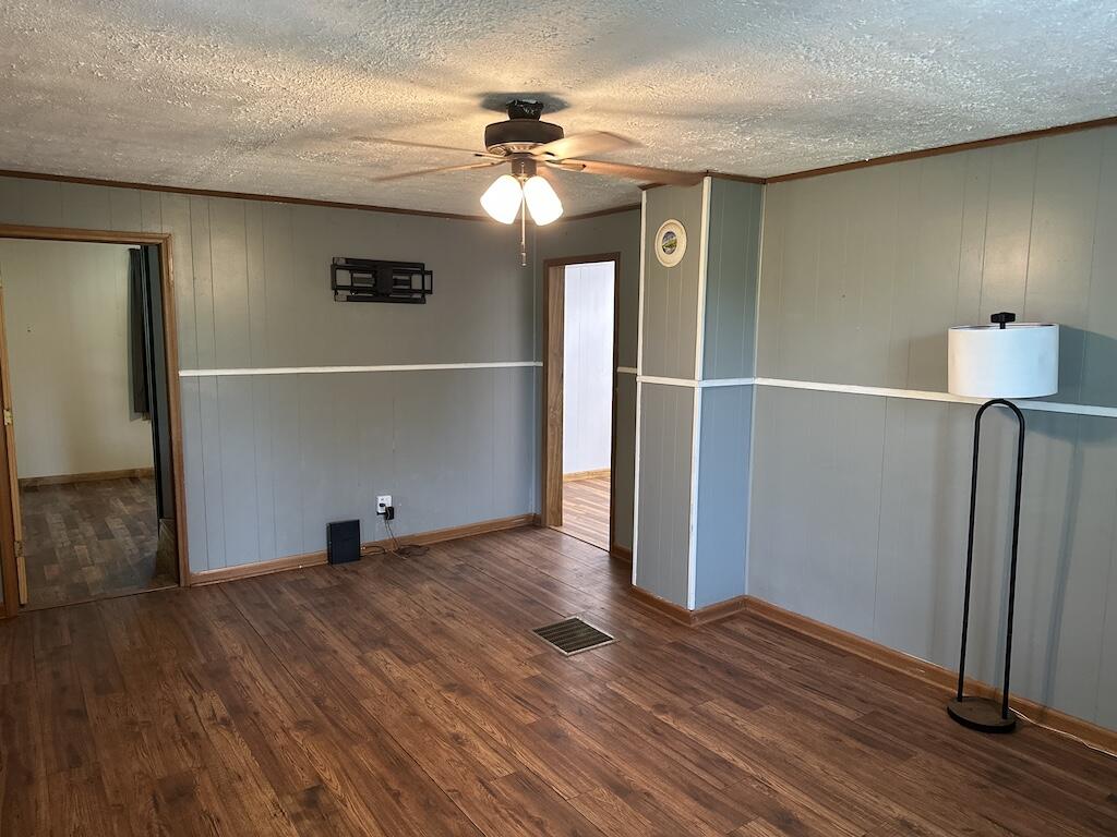 2638 Castleton Road Max Meadows, VA 24360 - Photo 6 of 46 an empty room with wooden floor and a chandelier