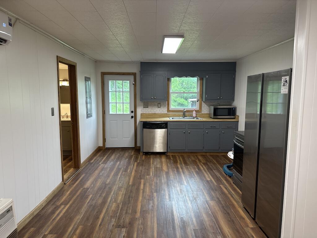2638 Castleton Road Max Meadows, VA 24360 - Photo 8 of 46 a kitchen with a wooden floor and a window