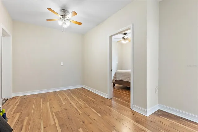wooden floor in an empty room with a window