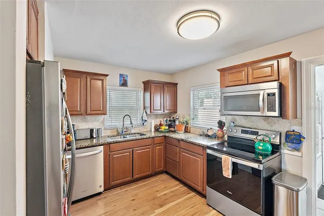 a kitchen with lots of counter top space and a sink