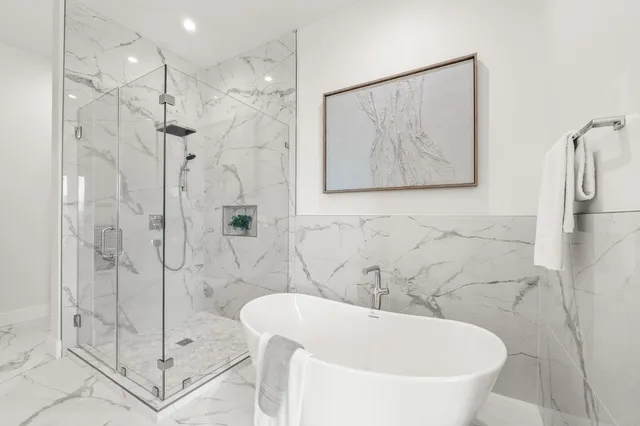 a bathroom with a bathtub and shower