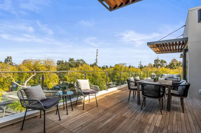 a view of a chairs and table on the deck