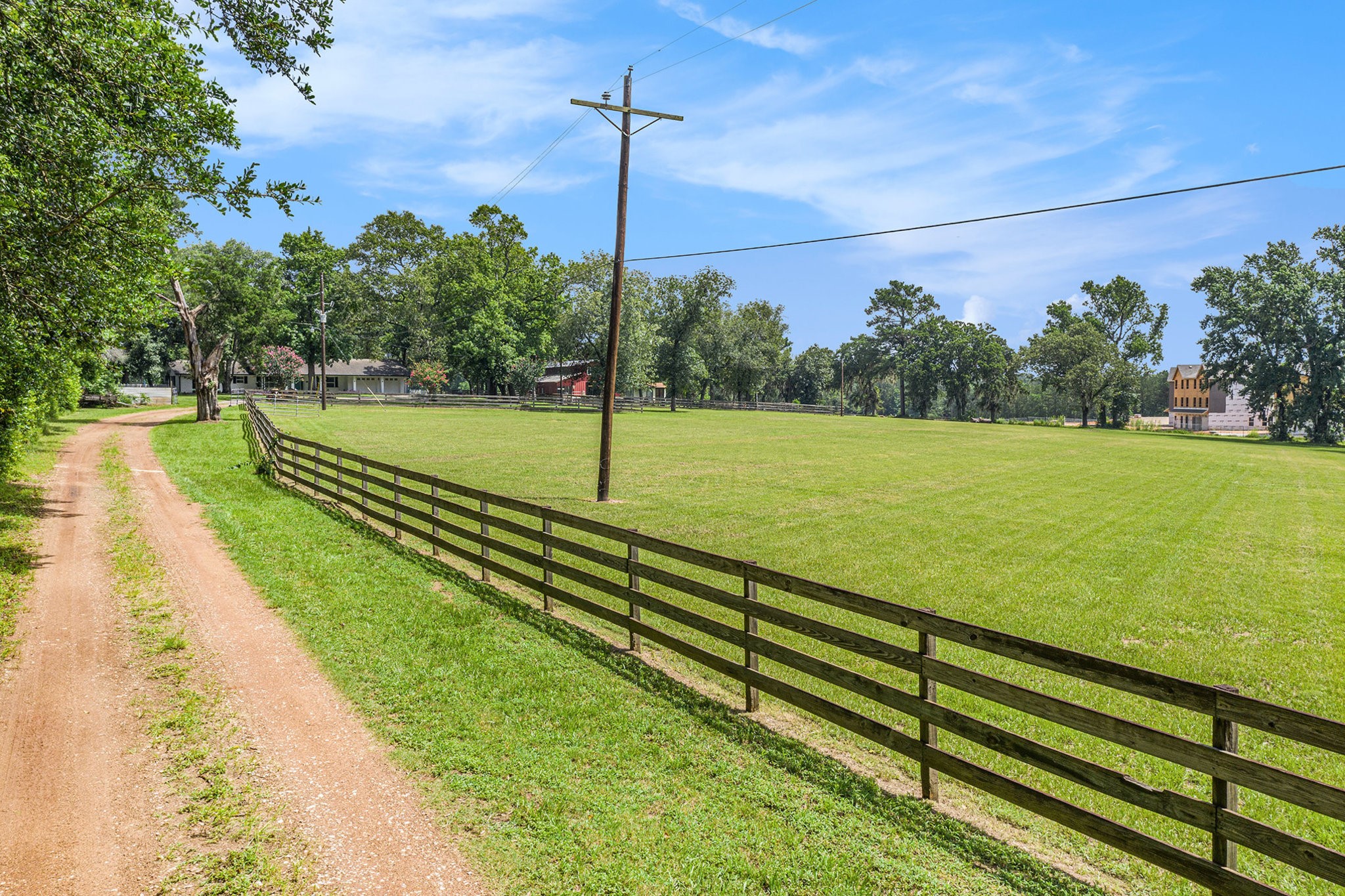 7363 County Line Road Willis, TX 77378 - Photo 34 of 34 Welcome home via a scenic long driveway lined with a lush side pasture.