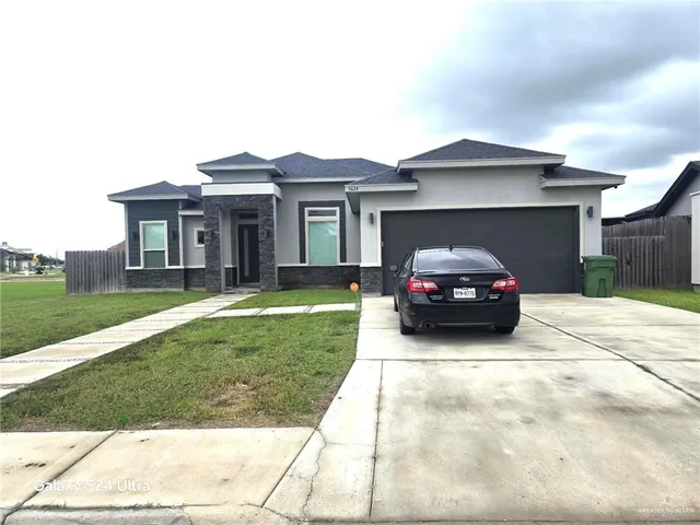 a house view with a garden space