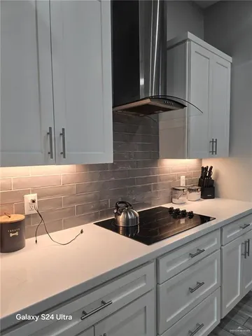 a kitchen with a sink and cabinets