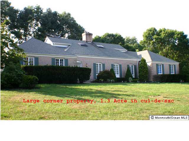 7 Saddle Ridge Road Colts Neck, NJ 07722 - Photo 1 of 3 a black and white photo of a house and a yard