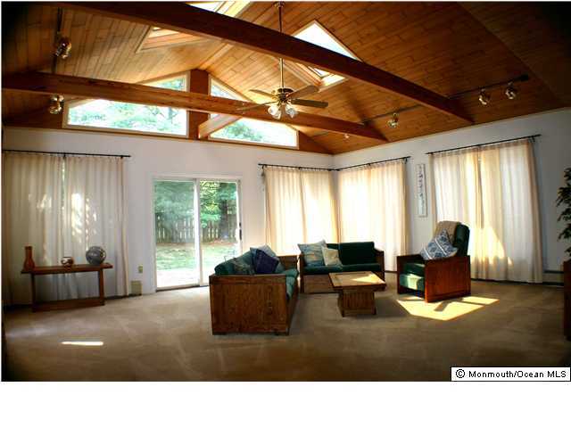 7 Saddle Ridge Road Colts Neck, NJ 07722 - Photo 3 of 3 a living room with furniture window and wooden floor